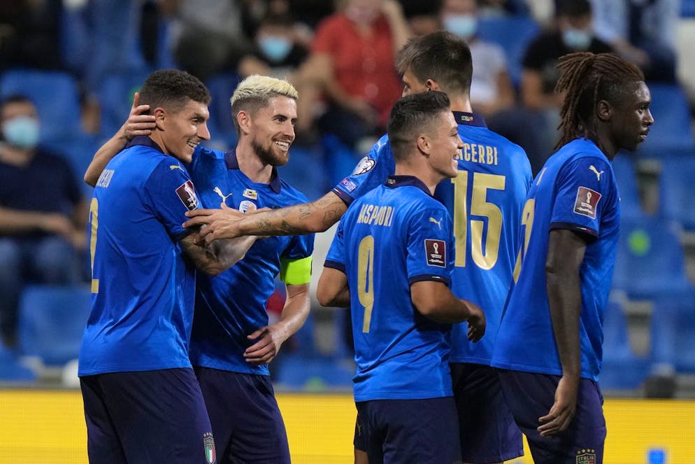 Italy's Giovanni Di Lorenzo, left, celebrates with bis teammates after scoring his side's fifth goal during the World Cup 2022 qualifier group C soccer match between Italy and Lithuania at the Città del Tricolore stadium in Reggio Emilia, Italy, Wednesday, Sept. 8, 2021. (AP Photo/Luca Bruno)