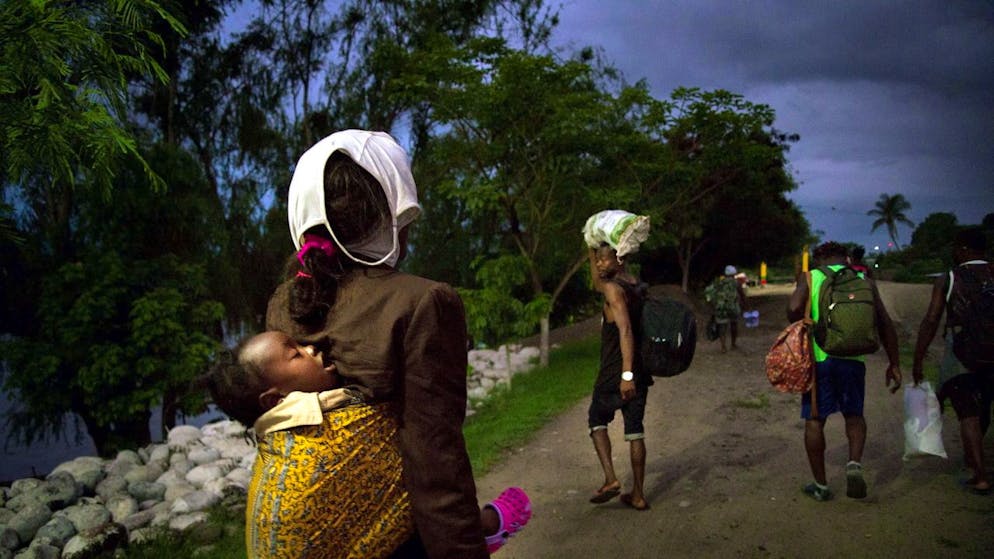 Migranti haitiani diretti verso il confine USA.
