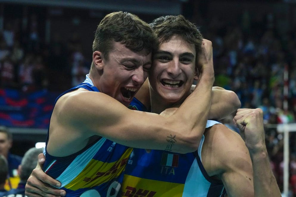 Italy's Alessandro Michieletto, right, celebrates after his side won the men's European Championship volleyball final against Slovenia, at the Spodek Arena in Katowice, Poland, Sunday, Sept. 19, 2021. (AP Photo/Czarek Sokolowski)