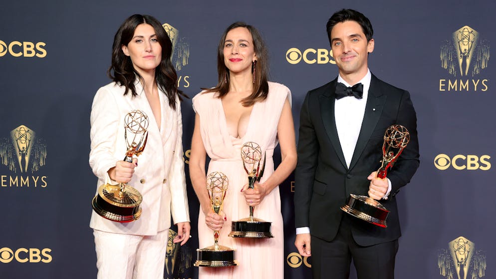 LOS ANGELES, CALIFORNIA - SEPTEMBER 19: (L-R) Jen Statsky, winner of the Outstanding Writing For A Comedy Series award for ‘Hacks’; Lucia Aniello, winner of the Outstanding Writing For A Comedy Series and Outstanding Directing For A Comedy Series awards for ‘Hacks’; and Paul W. Downs, winner of the Outstanding Writing For A Comedy Series award for ‘Hacks,’ pose in the press room during the 73rd Primetime Emmy Awards at L.A. LIVE on September 19, 2021 in Los Angeles, California. (Photo by Rich Fury/Getty Images)