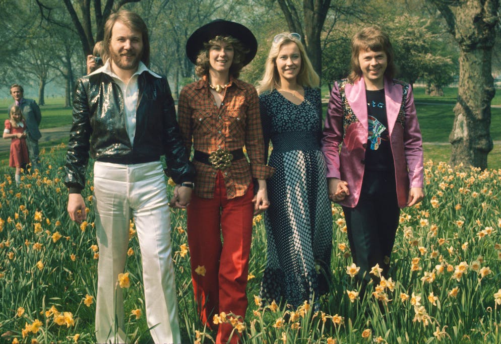 LONDON, UNITED KINGDOM - APRIL 09: Swedish pop group Abba, winners of the 1974 Eurovision Song Contest at Brighton, strolling hand in hand amongst the daffodils in Hyde Park on April 09, 1974 in London, England. (Photo by Anwar Hussein/Getty Images)