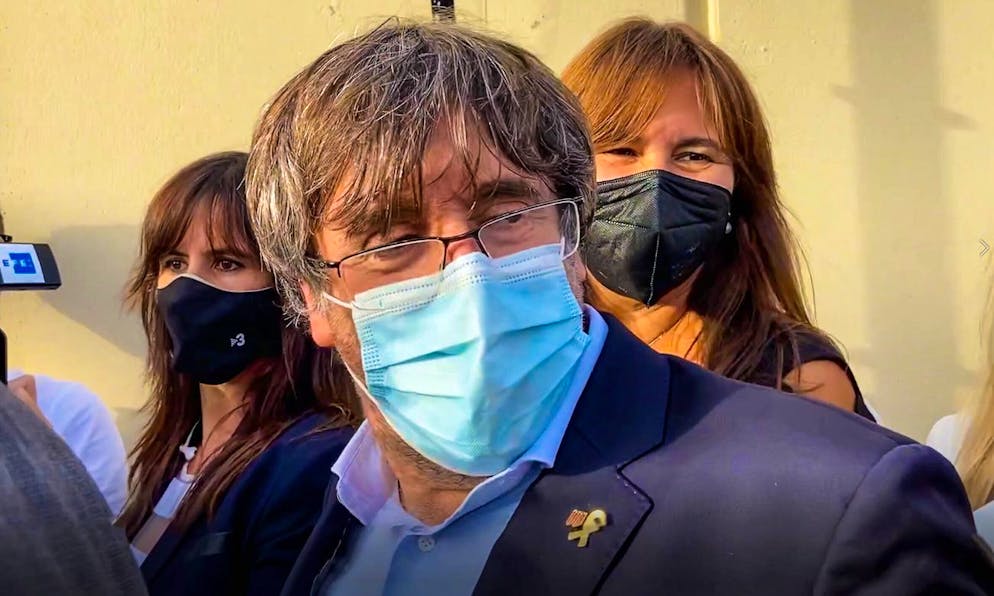 Catalan leader Carles Puigdemont, leaves the jail of Sassari, in Sardinia, Italy, Friday, Sept. 24, 2021. Puigdemont, sought by Spain for a failed 2017 secession bid, on Friday was released following a court hearing, ahead of an Italian court decision on Spain's extradition request, a day after Italian police detained him in Sardinia, an Italian island with strong Catalan cultural roots and its own independence movement. (AP Photo/Gloria Calvi)