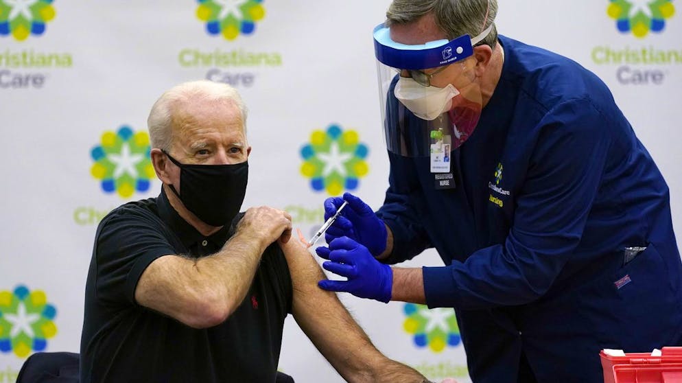 President-elect Joe Biden receives his second dose of the coronavirus vaccine at ChristianaCare Christiana Hospital in Newark, Del., Monday, Jan. 11, 2021. The vaccine is being administered by Chief Nurse Executive Ric Cuming. (AP Photo/Susan Walsh)