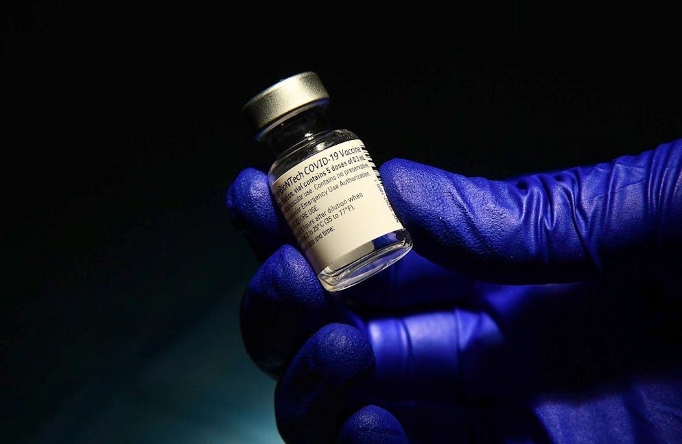 epa08920768 vial of a dose of the Pfizer-BioNTech vaccine at the Villa Scassi Hospital in Genoa, Italy, 05 January 2021. A second batch of 470,000 doses of the Pfizer-BioNTech COVID-19 vaccine reportedly has arrived in Italy and more than 100,000 people have been vaccinated with it so far in Italy. EPA/LUCA ZENNARO
