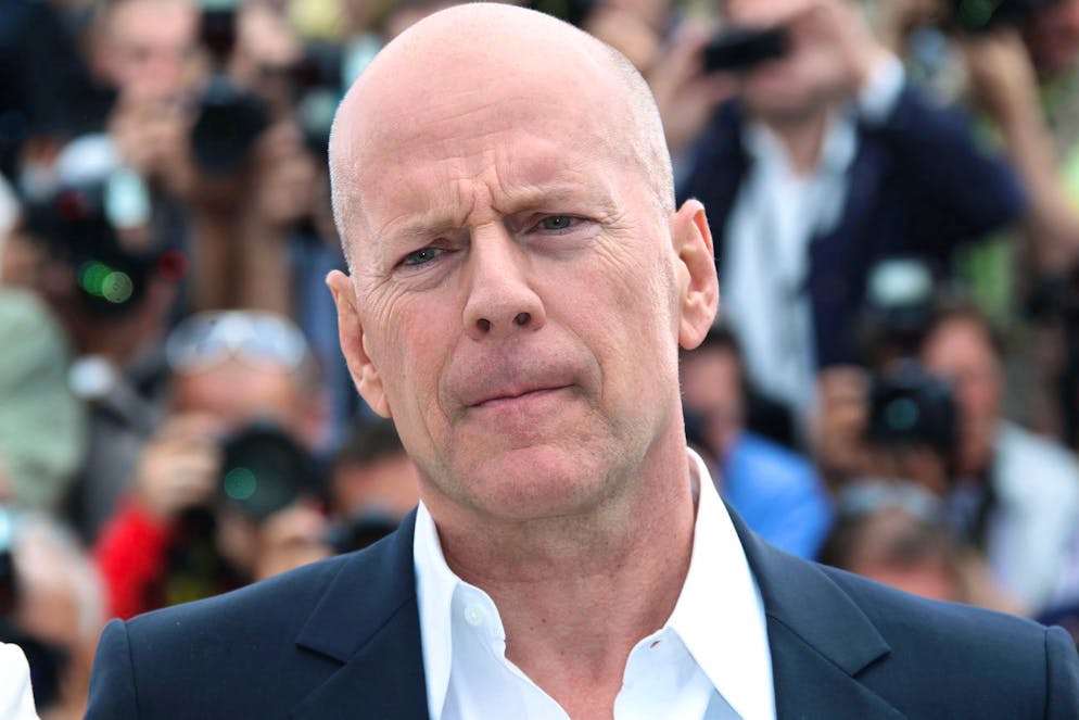 Actor Bruce Willis poses during a photo call for Moonrise Kingdom at the 65th international film festival, in Cannes, southern France, Wednesday, May 16, 2012. (AP Photo/Joel Ryan)