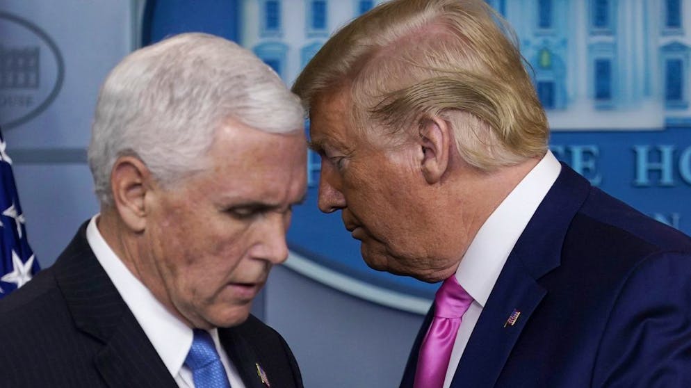 President Donald Trump moves to let Vice President Mike Pence speak during a news conference about coronavirus in the Brady Press Briefing Room of the White House, Wednesday, Feb. 26, 2020, in Washington. (AP Photo/Evan Vucci)
