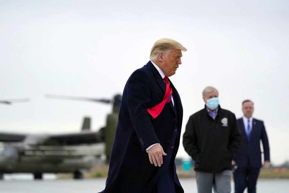 President Donald Trump boards Air Force One upon arrival at Valley International Airport, Tuesday, Jan. 12, 2021, in Harlingen, Texas, after visiting a section of the border wall with Mexico in Alamo, Texas. (AP Photo/Alex Brandon)