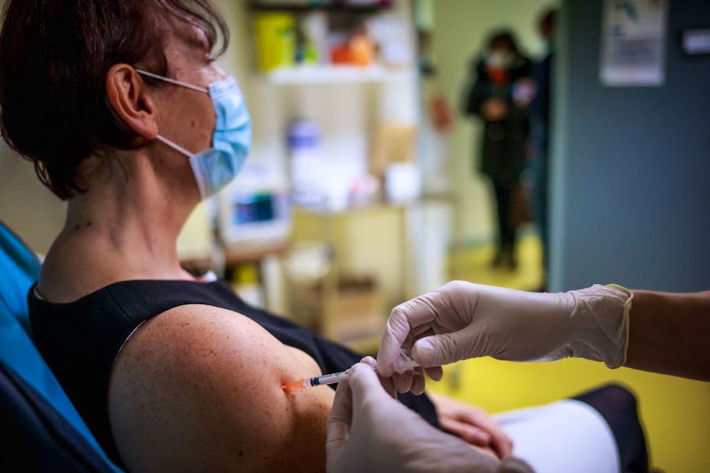 epa08925394 A medical staff member older than 50 is administered the Pfizer-BioNTech COVID-19 vaccine during a medical staff members vaccination at the Semur en Auxois hospital center, near Dijon, France, 07 January 2021. France began its coronavirus disease (COVID-19) vaccination campaign on 27 December 2020. The French government has faced criticism over the slow progress of its drive to vaccinate people, a problem compounded by the high levels of public skepticism about the campaign. EPA/CHRISTOPHE PETIT TESSON