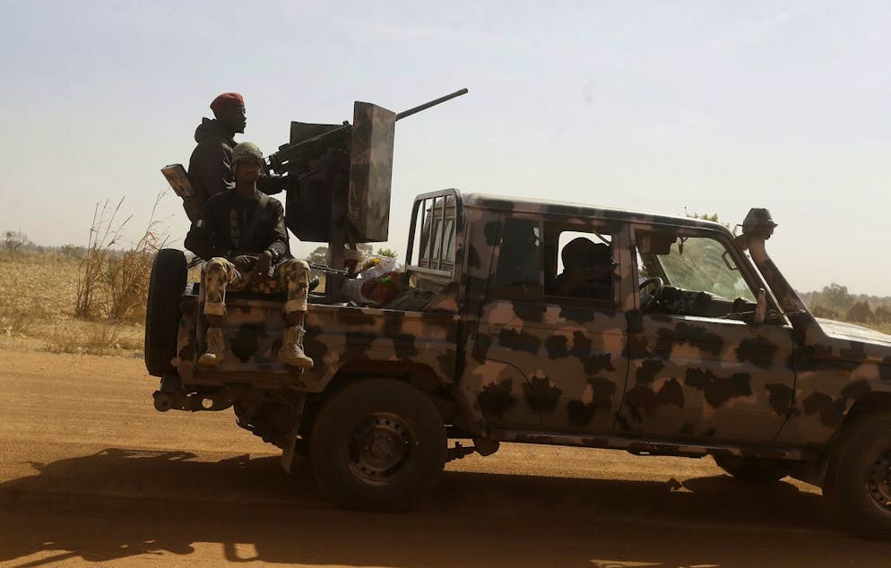 Nigerian soldiers drive past Government Science secondary school in Kankara, Nigeria, Wednesday, Dec. 16, 2020. Rebels from the Boko Haram extremist group claimed responsibility Tuesday for abducting hundreds of boys from a school in Nigeria's northern Katsina State last week in one of the largest such attacks in years, raising fears of a growing wave of violence in the region. (AP Photo/Sunday Alamba)