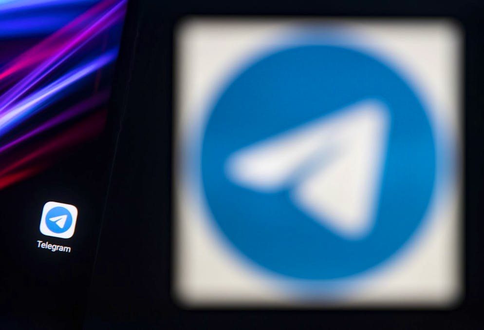 epa08967948 A photo illustration shows the logo of social media messaging application Telegram on a computer and on a mobile telephone screen, in Paris, France, 27 January 2021. The popular application (app) Whatsapp has faced backlash after announcing on 04 January a change to its privacy policy under which users widely interpreted that personal information would be shared with the app's parent company, Facebook. Although the policy change allegedly was only to affect interactions with business accounts, it prompted millions of users to migrate to rival messaging applications such as Signal and Telegram. EPA/IAN LANGSDON