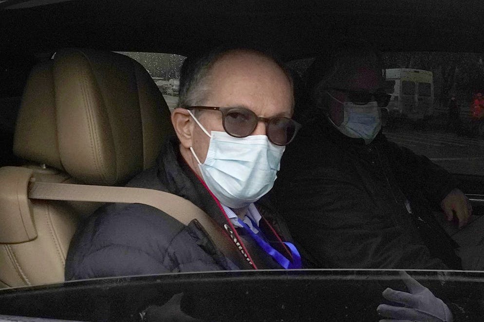 Peter Ben Embarek of the World Health Organization team leaves in a convoy from the Baishazhou wholesale market on the third day of field visit in Wuhan in central China's Hubei province on Sunday, Jan. 31, 2021. (AP Photo/Ng Han Guan)
