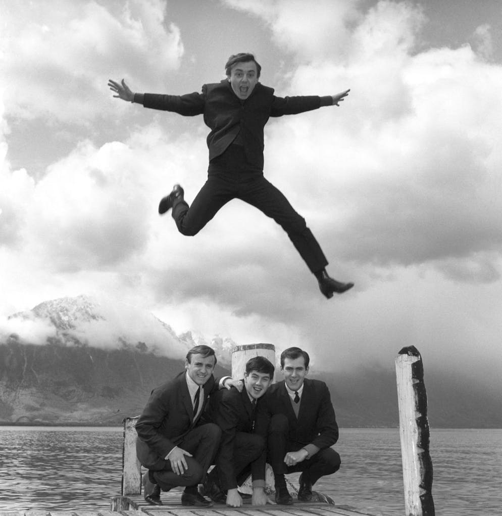 FILE - In this April 25, 1964 file photo, Gerry Marsden jumps on top of his band, the Pacemakers.  Gerry Marsden, the British singer and lead vocalist for Gerry and the Pacemakers, who was instrumental in converting a song from the Rodgers and Hammerstein musical âÄœCarouselâÄ ??  in one of the great anthems of the football world, he has died.  He was 78 years old (PA via AP, file)