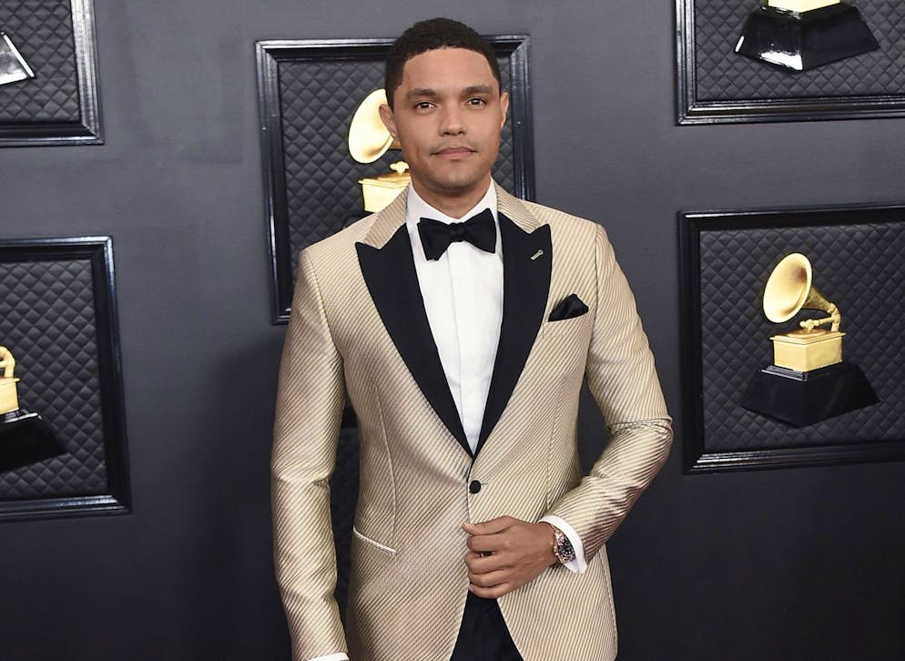 FILE - Trevor Noah arrives at the 62nd annual Grammy Awards in Los Angeles on Jan. 26, 2020. Noah has been tapped to host the 2021 Grammy Awards. The Recording Academy made the announcement hours before the nominees for the 2021 show would be revealed. It would mark Noah's first time hosting the Grammys. (Photo by Jordan Strauss/Invision/AP, File)