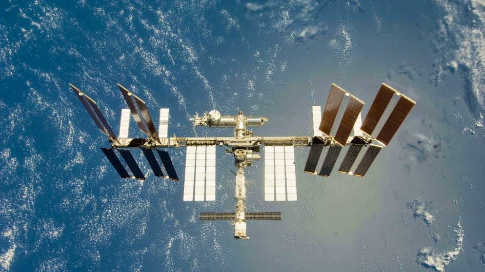 This image provided by NASA shows the International Space Station backdropped by a blue and white Earth as seen from Space Shuttle Endeavour as the two spacecraft begin their relative separation Tuesday July 28, 2009. Endeavour is sheduled to land at Florida's Kennedy Space Center Friday July 31, 2009 at 10:48 a.m. EDT. (AP Photo/NASA)