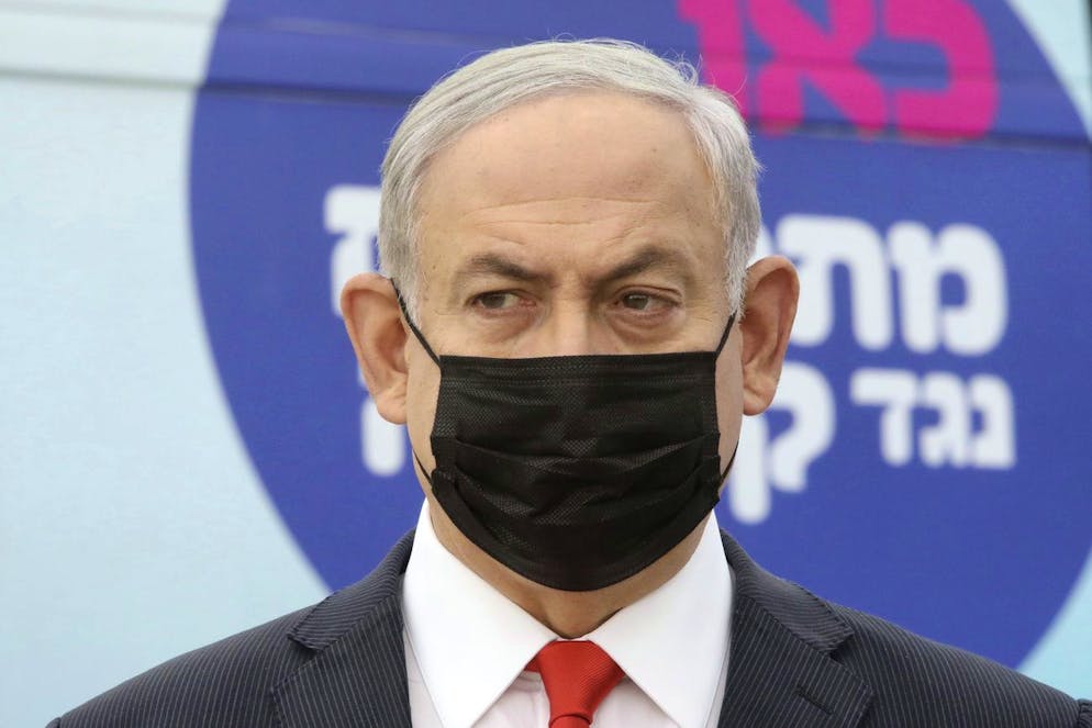 Israeli Prime Minister Benjamin Netanyahu visits the Maccabi Healthcare Services vaccine complex for COVID-19, in Tel Aviv, Israel, Dec. 13, 2020. (Marc Israel Sellem/Pool via AP)