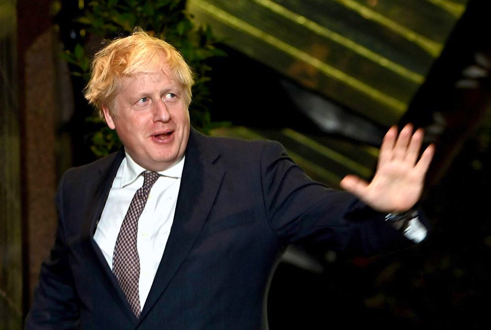 epa09502451 Britain's Prime Minster Boris Johnson (L) arrives at his political party annual conference in Manchester, Britain, 02 October 2021. The Conservative Party conference runs from 03 to 06 October 2021. EPA/NEIL HALL