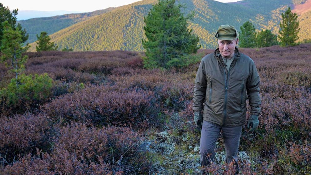 In this undated pool photo released by the Kremlin Press Service via Sputnik on Sunday, Sept. 26, 2021, Russian President Vladimir Putin walks during his and Russian Defense Minister Sergei Shoigu short vacation in early September, 2021 after his working visit to the Primorye and the Amur Region of the Russian Far East. (Alexei Druzhinin, Sputnik, Kremlin Pool Photo via AP)