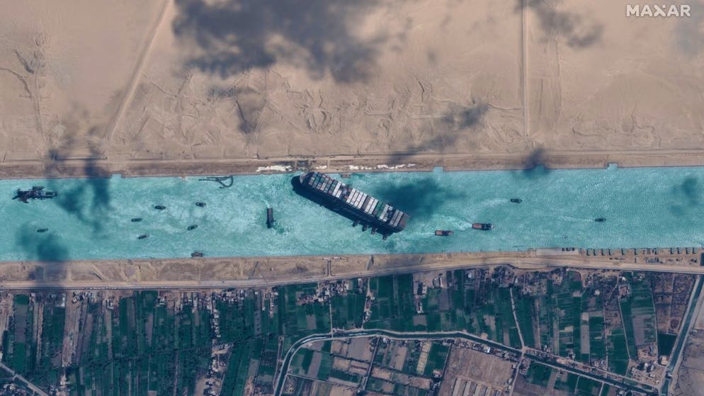 epa09105217 A handout satellite image made available by MAXAR Technologies shows , the Ever Given container ship after it has been moved away from the eastern bank of the canal and tugboats trying to reposition the ship, in the Suez Canal, Egypt, 29 March 2021. The head of the Suez Canal Authority announced on 29 March that the large container ship, which ran aground in the Suez Canal on 23 March, is now free floating after responding to the pulling maneuvers. EPA/MAXAR TECHNOLOGIES HANDOUT --MANDATORY CREDIT: SATELLITE IMAGE 2020 MAXAR TECHNOLOGIES -- the watermark may not be removed/cropped -- HANDOUT EDITORIAL USE ONLY/NO SALES
