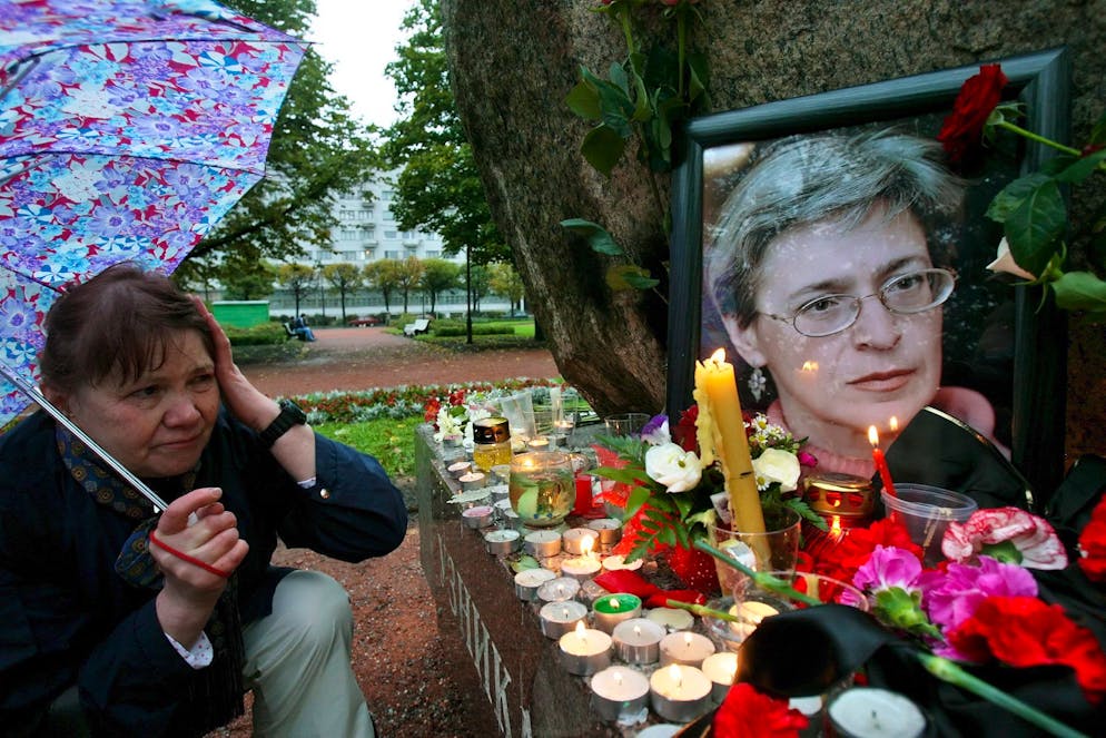 A woman mourns in front of the portrait of prominent Russian journalist Anna Politkovskaya in St.Petersburg, Sunday, 08 October 2006. Prominent Russian journalist Anna Politkovskaya was murdered on Saturday 07 October as she entered the elevator in her building. Russian Prosecutor General Yury Chaika on Sunday took charge of the investigation into the murder on Saturday of prominent journalist Anna Politkovskaya as law enforcers followed up a suspected Chechen link in her assassination. EPA/ANATOLY MALTSEV