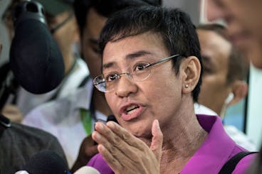 CEO of Philippine news website Rappler, Maria Ressa, gestures as she speaks to the media as she arrives at the National Bureau of Investigation (NBI) headquarters in Manila on January 22, 2018.
The head of a news website threatened with closure by the government appeared before state investigators on January 22 over a defamation complaint which she decried as part of President Rodrigo Duterte's concerted attack on press freedom. / AFP PHOTO / NOEL CELIS        (Photo credit should read NOEL CELIS/AFP via Getty Images)