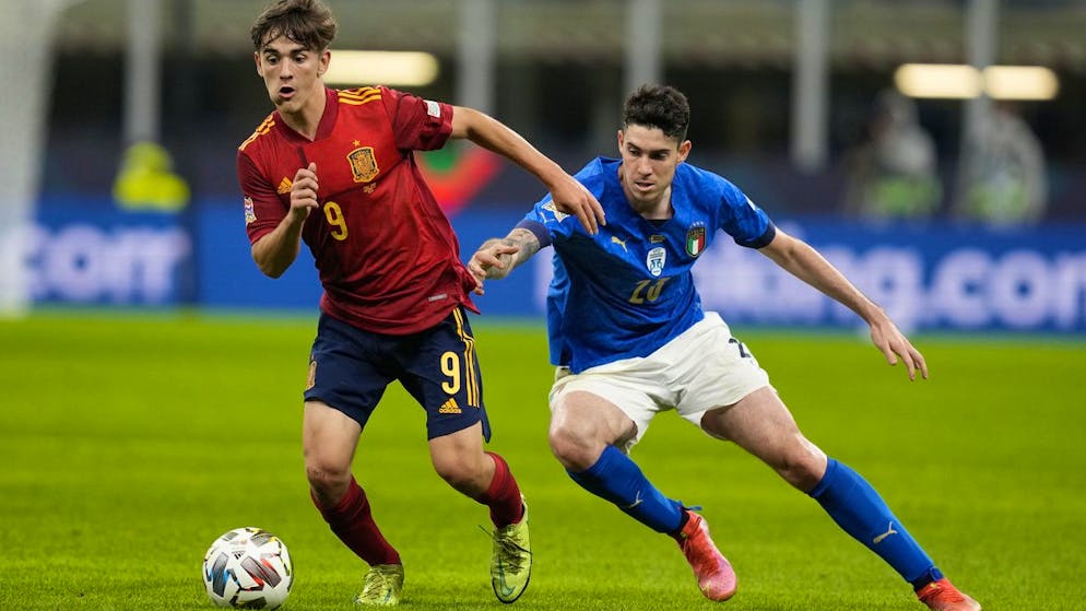 Spain's Gavi, left, and Italy's Alessandro Bastoni vie for the ball during the UEFA Nations League semifinal soccer match between Italy and Spain at the San Siro stadium, in Milan, Italy, Wednesday, Oct. 6, 2021. (AP Photo/Antonio Calanni)