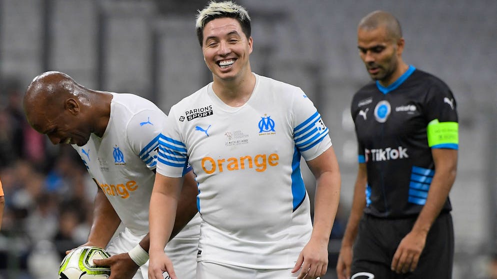 TOPSHOT - French former player Samir Nasri reacts during the charity