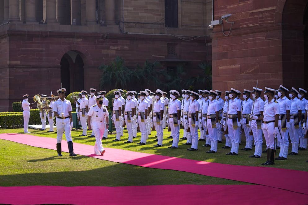 U.S. Chief of Naval Operations Admiral Michael Gilday inspects a guard of honor upon his arrival at the defense ministry in New Delhi, India, Tuesday, Oct. 12, 2021. Gilday is on a five-day visit to India. (AP Photo/Manish Swarup)
