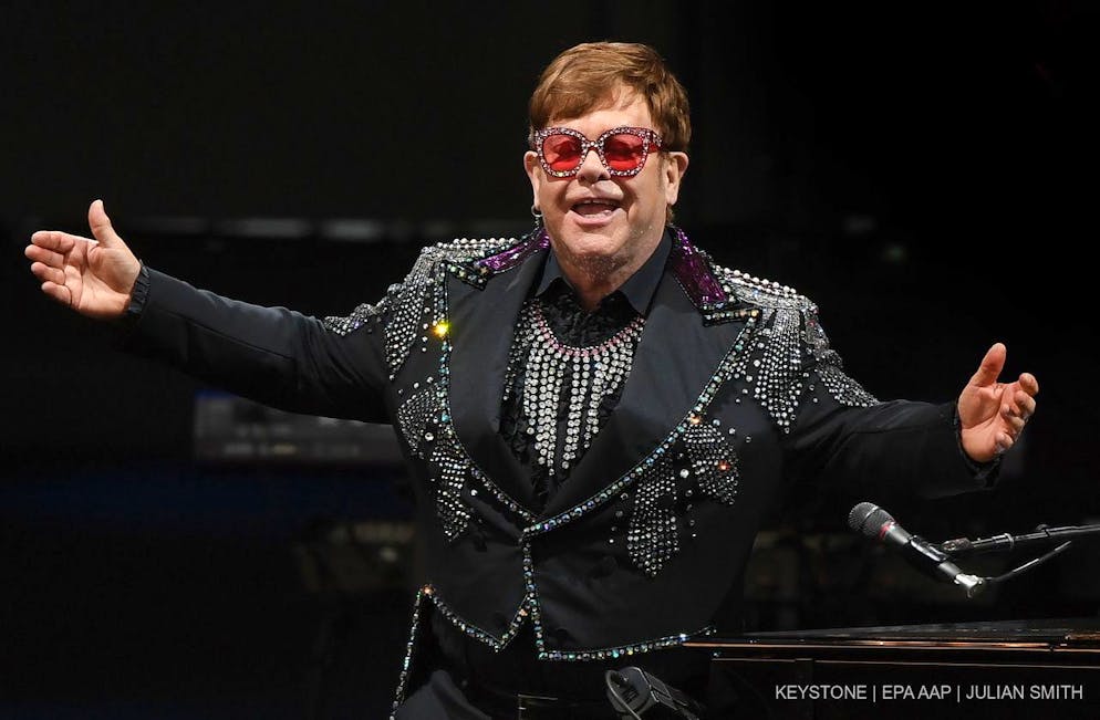 epa09471323 (FILE) - British musician Elton John performs on stage during 'A Day On The Green' music festival at Mt Duneed Estate in Geelong, Australia, 07 December 2019 (re-issued 16 September 2021). Elton John on his Instagram account announced on 16 September that he had to reschedule the 2021 tour dates of his 'Farewell Yellow Brick Road' in Eruropean and the UK to 2023 due to illness. EPA/JULIAN SMITH AUSTRALIA AND NEW ZEALAND OUT *** Local Caption *** 55880672