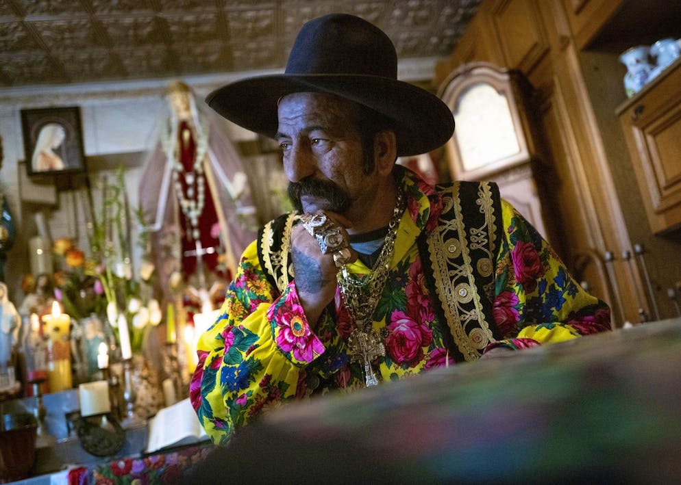 Zoltan Sztojka, traditional Gypsy fortune-teller is seen in his home in Soltvadkert, central Hungary on Oct. 10, 2021. Sztojka, by his own account HungaryâÄ™s last Roma fortuneteller, is working to preserve his culture's traditions that are slowly vanishing in the Central European country. (AP Photo/Bela Szandelszky)