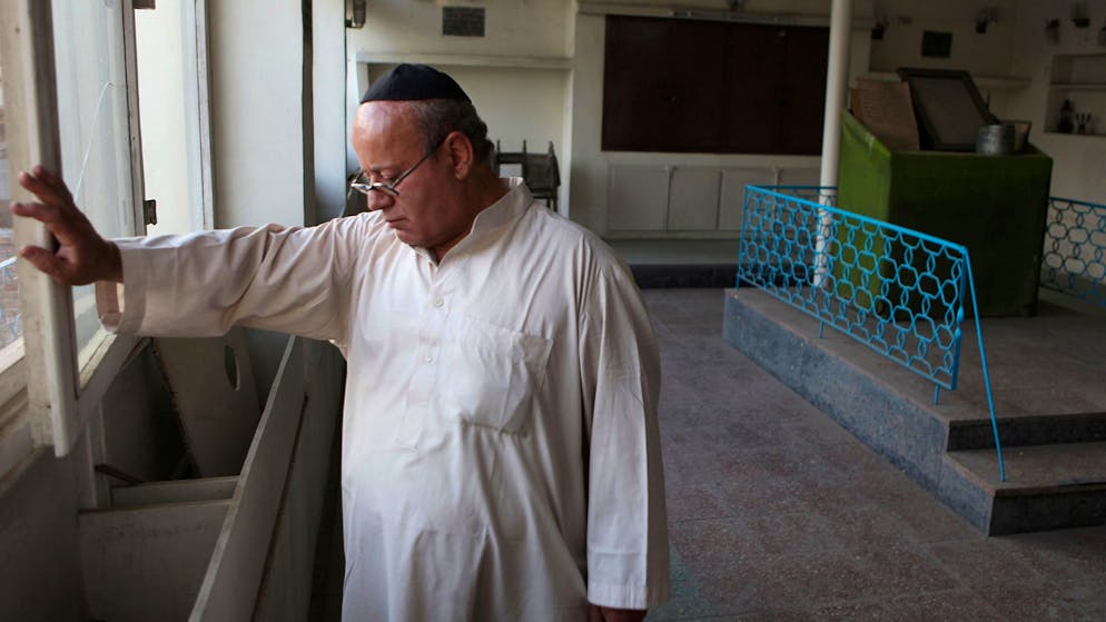 FILE - In this Aug. 29, 2009 file photo, Zebulon Simentov, the last known Jew living in Afghanistan, closes the window to the synagogue he cares for in his Kabul home. Simentov who prayed in Hebrew, endured decades of war as the country's centuries-old Jewish community rapidly dwindled has left the country. The Taliban takeover in August, 2021, seems to have been the last straw. (AP Photo/David Goldman, File)