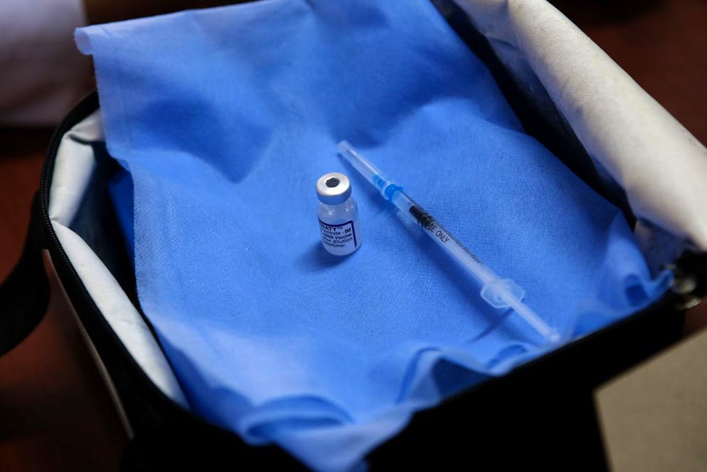 A Pfizer COVID-19 vaccine is prepared at a vaccination center in Casablanca, Morocco, Monday, Oct. 18, 2021. Indicators continue to decline from the start of a third wave, for the tenth consecutive week. (AP Photo/Abdeljalil Bounhar)
