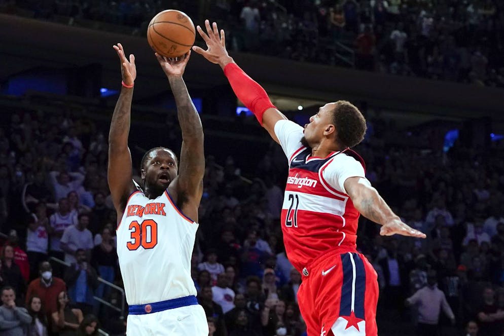 New York Knicks forward Julius Randle (30) shoots the go-ahead 3-pointer Washington Wizards center Daniel Gafford (21) in an NBA basketball game Friday, Oct. 15, 2021, at Madison Square Garden in New York. (AP Photo/Mary Altaffer)