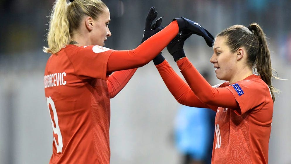 Swiss Ana-Maria Crnogorcevic ,left, and Swiss Ramona Bachmann, right, celebrates after the third goal during the UEFA Women's Euro 2021 Group H qualifying soccer match between Switzerland and Romania in Schaffhausen, Switzerland, November 12, 2019. (KEYSTONE/Walter Bieri)