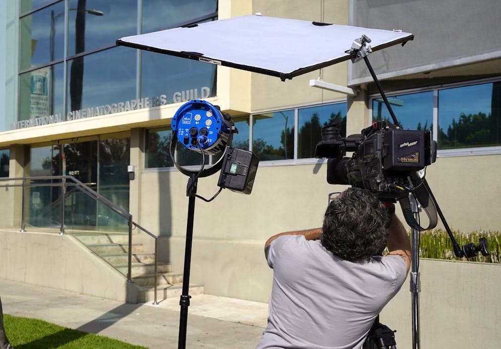 A cameraman films the front entrance of the International Cinematographers Guild Local 600, Friday, Oct. 22, 2021, in Los Angeles. Cinematographer and guild member Halyna Hutchins was killed Thursday and director Joel Souza injured after actor Alec Baldwin fired a prop gun on the set of a Western film in Santa Fe, N.M. (AP Photo/Chris Pizzello)