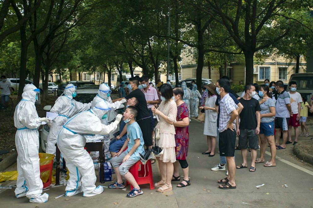 Residents line up to be tested for COVID-19 in Wuhan in central China's Hubei province Tuesday, Aug. 03, 2021. The coronavirusâÄ™s delta variant is challenging ChinaâÄ™s costly strategy of isolating cities, prompting warnings that Chinese leaders who were confident they could keep the virus out of the country need a less disruptive approach. (Chinatopix via AP)