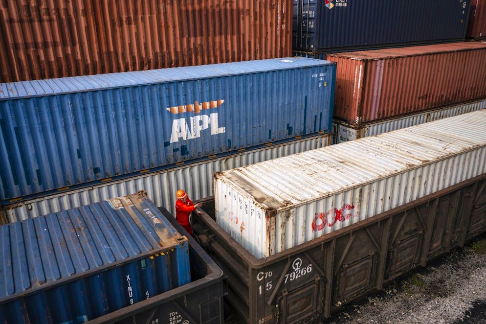 epa09473298 A photo made with a drone shows a the containers being loaded to the train to Kazakhstan in the China-Kazakhstan Logistic Base during the organised media tour in Lianyungang, Jiangsu province, China, 17 September 2021. China-Kazakhstan Logistic Base.is an important sea port for Kazakhstan export and provides efficient transit for cargo and consumer goods from the central Asian country. It is recognised as a sample of collaboration between the 'The Belt And Road' countries. EPA/ALEX PLAVEVSKI