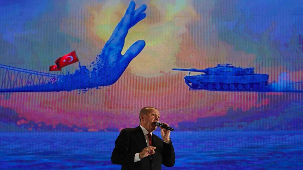Turkey's President Recep Tayyip Erdogan gestures as he delivers a speech at a rally to honor the victims of the July 15, 2016, failed coup attempt, in Istanbul, Monday, July 15, 2019. Turkey is marking the third anniversary of the failed coup attempt against the government, with prayers and other events remembering its victims. (AP Photo/Lefteris Pitarakis)