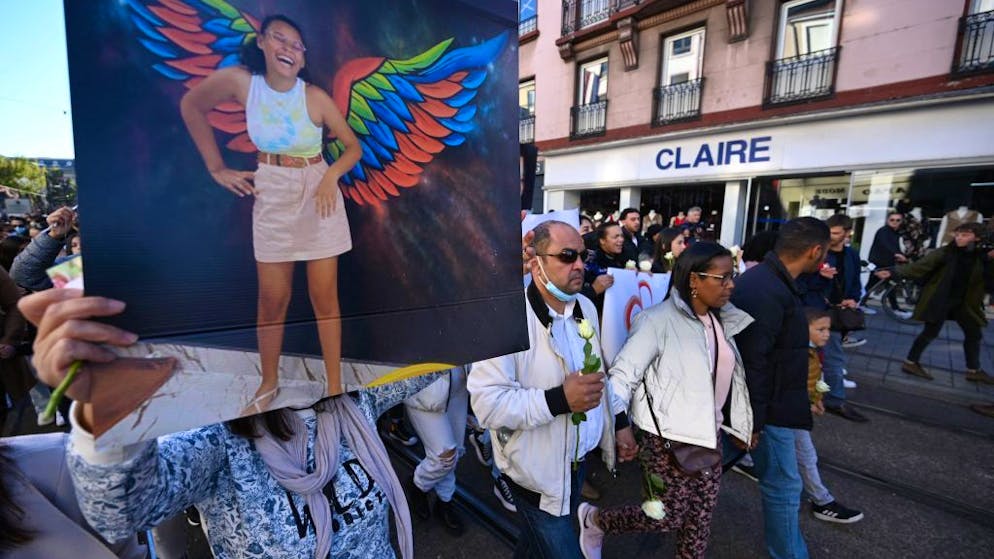 2ndLtoR, The father, mother and brother of Dinah participate in a white march in Mulhouse, eastern France, on October 24, 2021, in memory of Dinah, 14, who committed a suicide after being harrassed by several teenagers for two years with racist and homophobic insults. (Photo by Frederick FLORIN / AFP) (Photo by FREDERICK FLORIN/AFP via Getty Images)