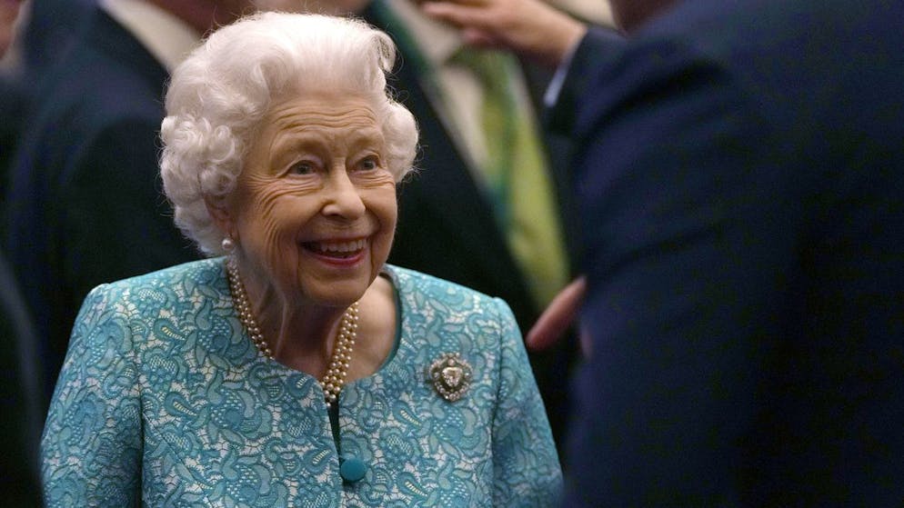 FILE - In this Tuesday, Oct. 19, 2021 file photo Britain's Queen Elizabeth II and Prime Minister Boris Johnson, left, greet guests at a reception for the Global Investment Summit in Windsor Castle, Windsor, England. Buckingham Palace says Queen Elizabeth II spent a night in a hospital after being advised by her doctor to rest. The palace says the 95-year-old British monarch went to hospital for