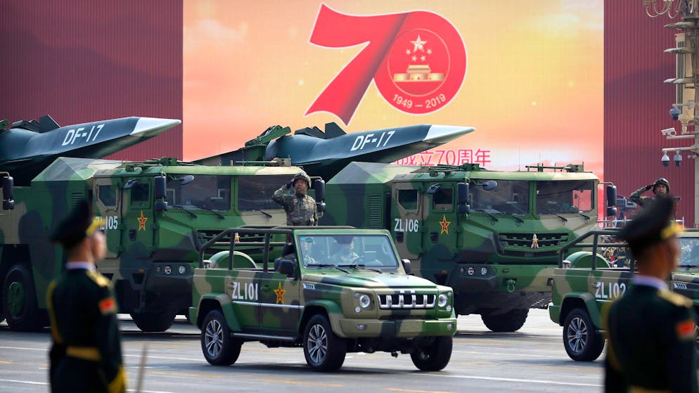 Chinese military vehicles carrying DF-17 ballistic missiles roll during a parade to commemorate the 70th anniversary of the founding of Communist China in Beijing, Tuesday, Oct. 1, 2019. Trucks carrying weapons including a nuclear-armed missile designed to evade U.S. defenses rumbled through Beijing as the Communist Party celebrated its 70th anniversary in power with a parade Tuesday that showcased China's ambition as a rising global force. (AP Photo/Mark Schiefelbein)