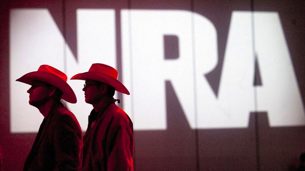 FILE - In this May 4, 2013, file photo, National Rifle Association members listen to speakers during the NRA's annual Meetings and Exhibits at the George R. Brown Convention Center in Houston. The NRA has been cutting staff and salaries amid the coronavirus pandemic. The changes come against the backdrop of years of internal turmoil, legal challenges with regulators and a revolt among some of its members. It also comes at a time when gun-rights supporters are hoping the NRA can play an influential role in this year's election (Johnny Hanson/Houston Chronicle via AP, File)