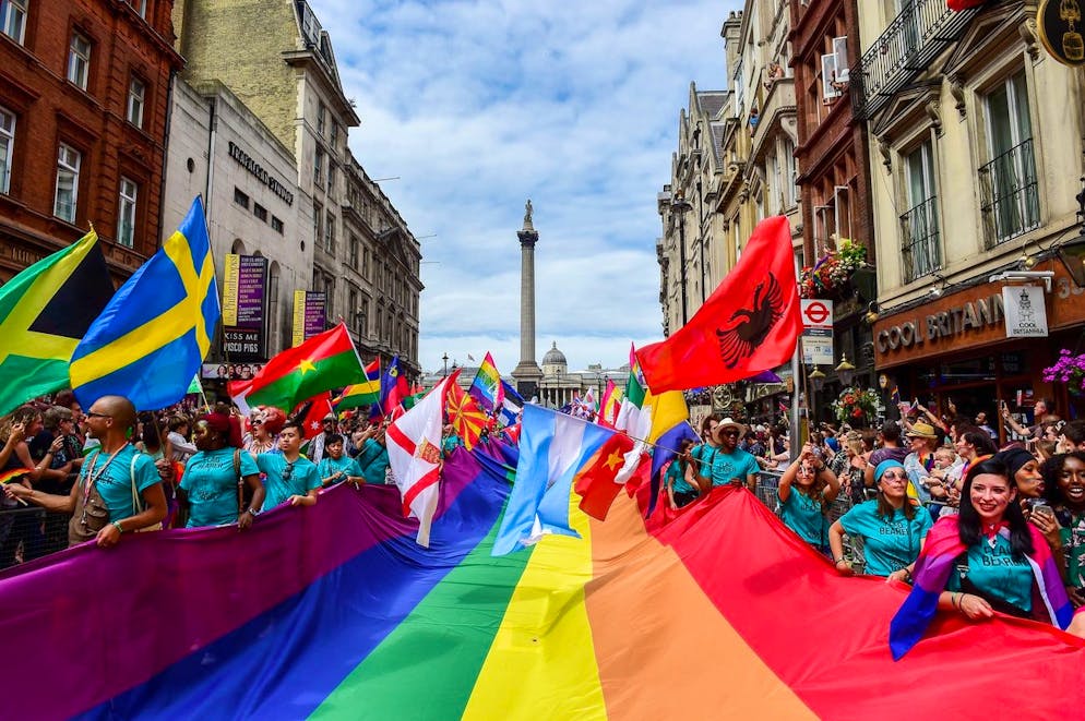 epa06076022 Participants carry a giant rainbow flag as they march in front of Nelson's Column during the London Pride, the Lesbian, Gay, Bisexual, and Transgender (LGBT) parade in London, Britain, 08 July 2017. The annual event aims to raise awareness and campaign for equality on LGBT issues. EPA/PETE MACLAINE