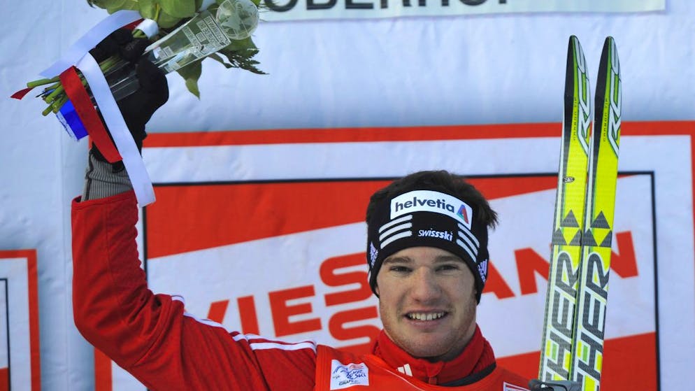 Dario Cologna of Switzerland celebrates on the podium after winning the men's 15 km run in the cross-country Tour de Ski competition in Oberhof, Germany, Sunday, Dec. 28, 2008. (AP Photo/Matthias Rietschel)