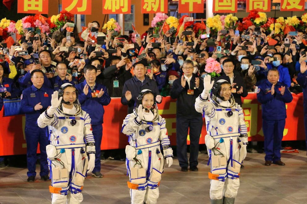 epa09525898 (L-R) Astronauts Ye Guangfu, Zhai Zhigang, and Wang Yaping, greet the crowd before their departure to Tiangong space station at the Jiuquan Satellite Launch Center in northwest China, 15 October 2021. The trio will stay in orbit for six months, a regular duration for future Tianhe space station visitors. EPA/LIU HUAIYU CHINA OUT