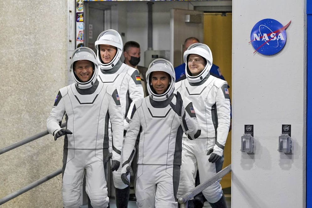 Astronauts, from left, Tom Marshburn, Matthias Maurer, of Germany, Raja Chari and Kayla Barron wave as they leave the Operations and Checkout building for a trip to Launch Pad 39-A Wednesday, Nov. 10, 2021, at the Kennedy Space Center in Cape Canaveral, Fla. The four astronauts are scheduled to fly on SpaceX's Crew-3 mission to the International Space Station. (AP Photo/John Raoux)