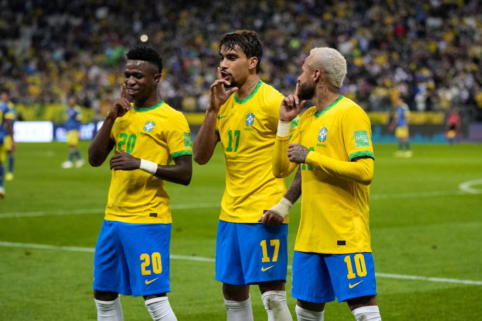 Brazil's Lucas Paqueta, center, celebrates with teammates Vini Jr, left, and Neymar after scoring his side's opening goal against Colombia during a qualifying soccer match for the FIFA World Cup Qatar 2022 at Neo Quimica Arena stadium in Sao Paulo, Brazil, Thursday, Nov.11, 2021. (AP Photo/Andre Penner)