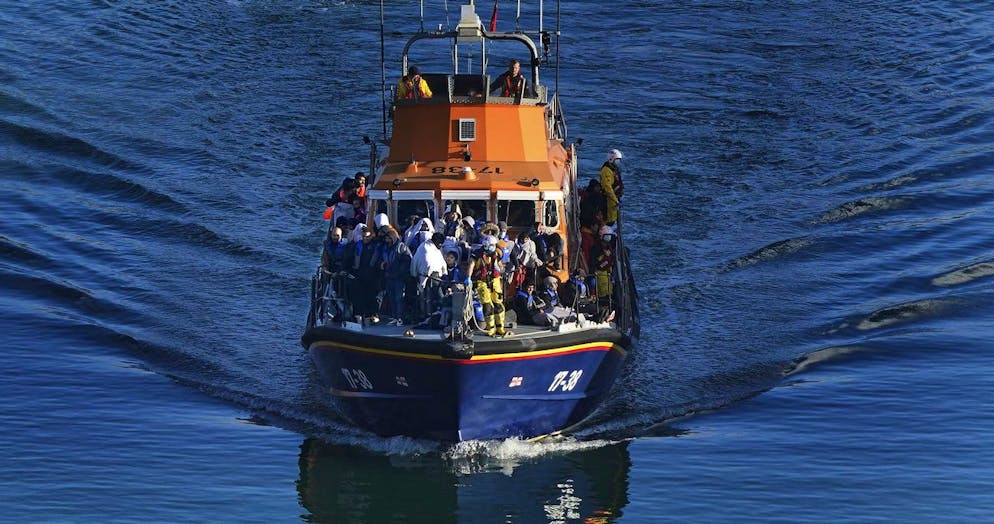 A group of people thought to be migrants are brought in to Dover, Kent, onboard the Dover lifeboat following a small boat incident in the Channel, England, Tuesday, Nov. 2, 2021. (Gareth Fuller/PA via AP)