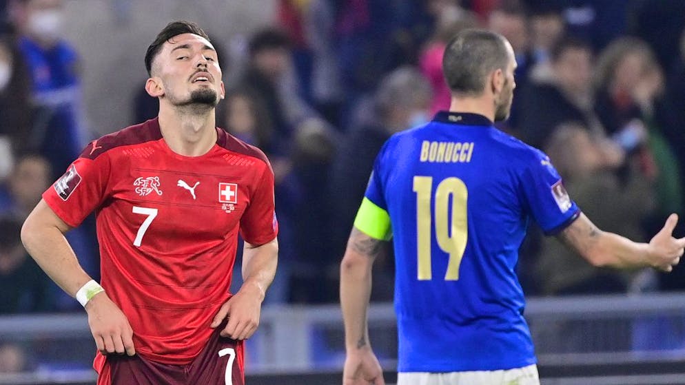 Switzerland's forward Andi Zeqiri, left, reacts next to Italy's defender Leonardo Bonucci, right, during the 2022 FIFA World Cup European Qualifying Group C match between Italy and Switzerland at the Stadio Olimpico in Rome, Italy, Friday, November 12, 2021. (KEYSTONE/Jean-Christophe Bott)