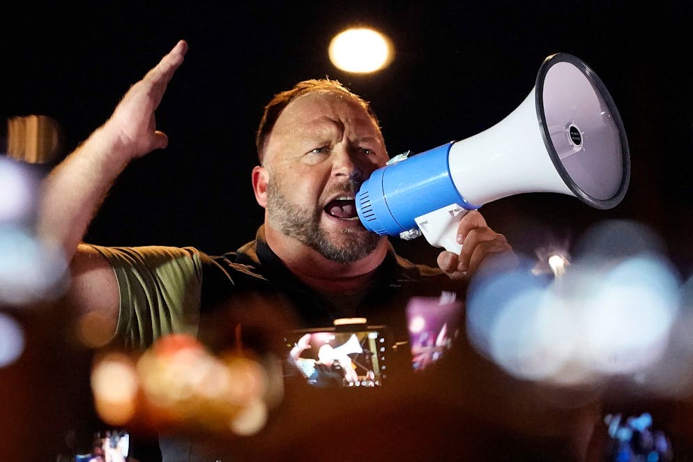 Far right radio host Alex Jones rallies pro Trump supporters outside the Maricopa County Recorder's Office, Thursday, Nov. 5, 2020, in Phoenix. (AP Photo/Matt York)
