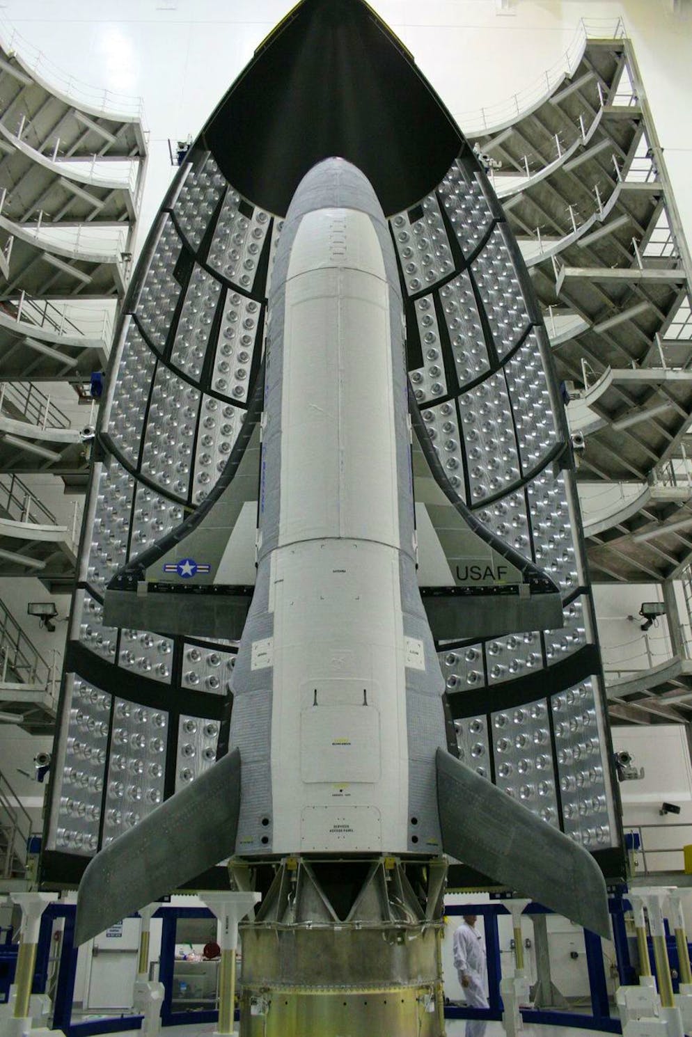 This April 5, 2010 photo made available by the U.S. Air Force via NASA shows the X-37B Orbital Test Vehicle at the Astrotech facility in Titusville, Fla. Half of the Atlas V five-meter fairing is in the background. On Tuesday, Dec. 11, 2012, the Air Force launched the top-secret, unmanned mini-space shuttle from Cape Canaveral, Fla. (AP Photo/U.S. Air Force via NASA)